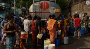 People gathered in a water tank to fetch water due to the increasing temperatures