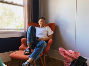 A student sitting on a chair in campus