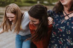 university students laughing together