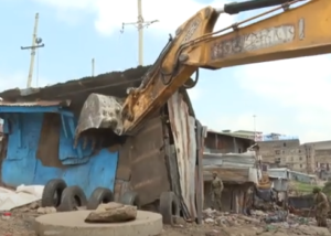 A trucktor demoliting a house